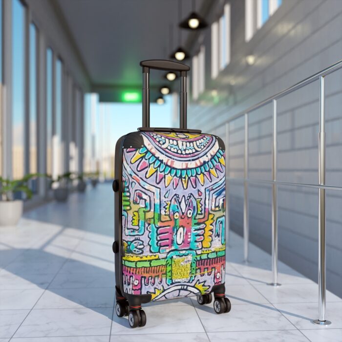 Hard-shelled luggage suitcase with four wheels and a handle showcasing colourful Meso-American Tonalism inspired motifs and patterns.