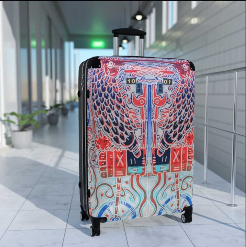 A Meso-American culture inspired hard shell suitcase with wheels.